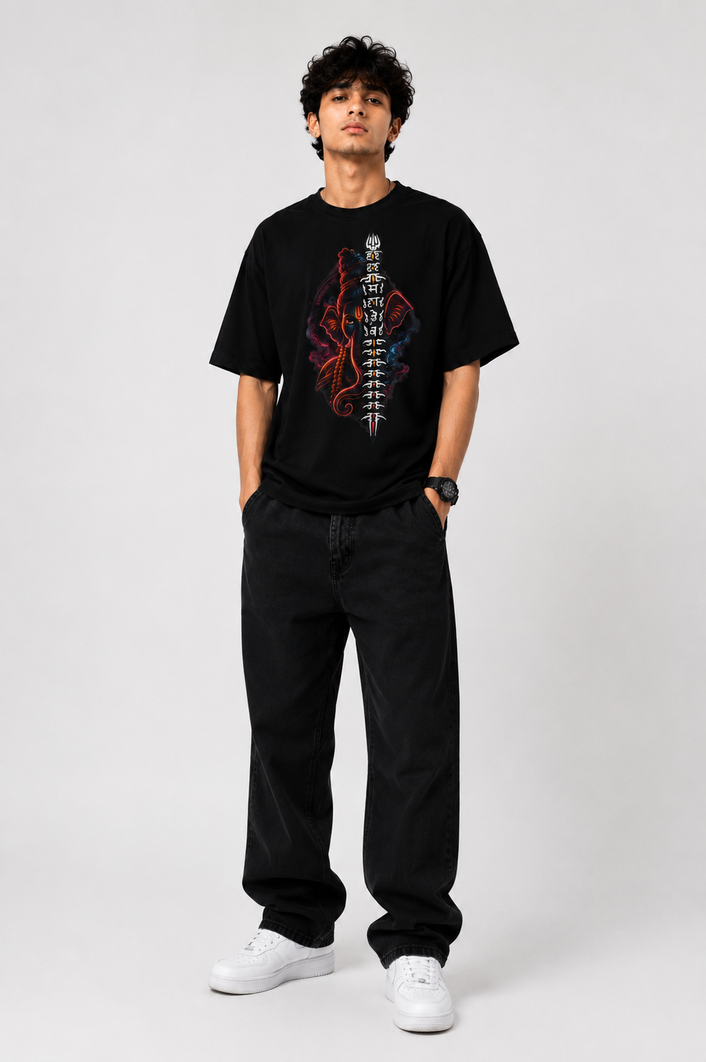 Black oversized graphic T-shirt from the StitchVaults™ GANESHA LEGACY™ Collection featuring a modern Lord Ganesha illustration with the sacred Har Har Mahadev mantra, Trishul motif, and glowing spiritual artwork.