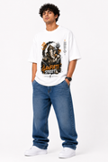 White oversized graphic T-shirt from the StitchVaults™ GANESHA LEGACY™ Collection featuring an artistic Lord Ganesha streetwear illustration with Om symbol, Trishul, Sanskrit text, and bold Ganpati Street typography.
