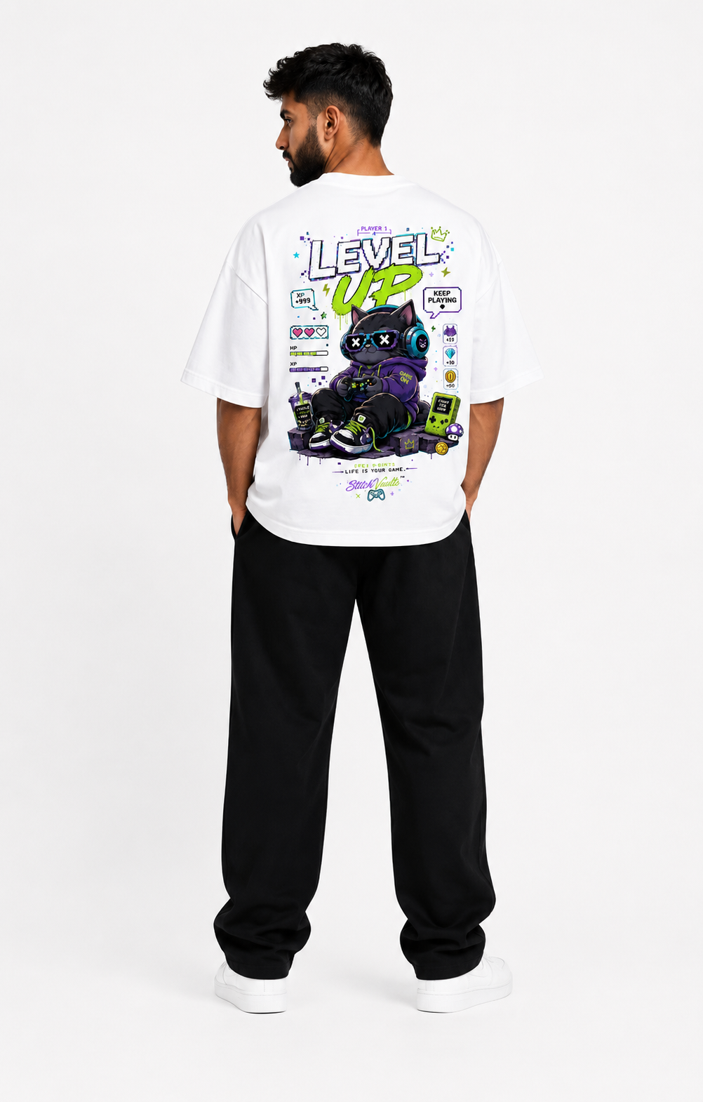 White oversized graphic T-shirt from the StitchVaults™ NOSTALGIA™ Collection featuring the Level Up gaming cat artwork inspired by retro arcade games, pixel graphics, controllers, and nostalgic gaming culture.