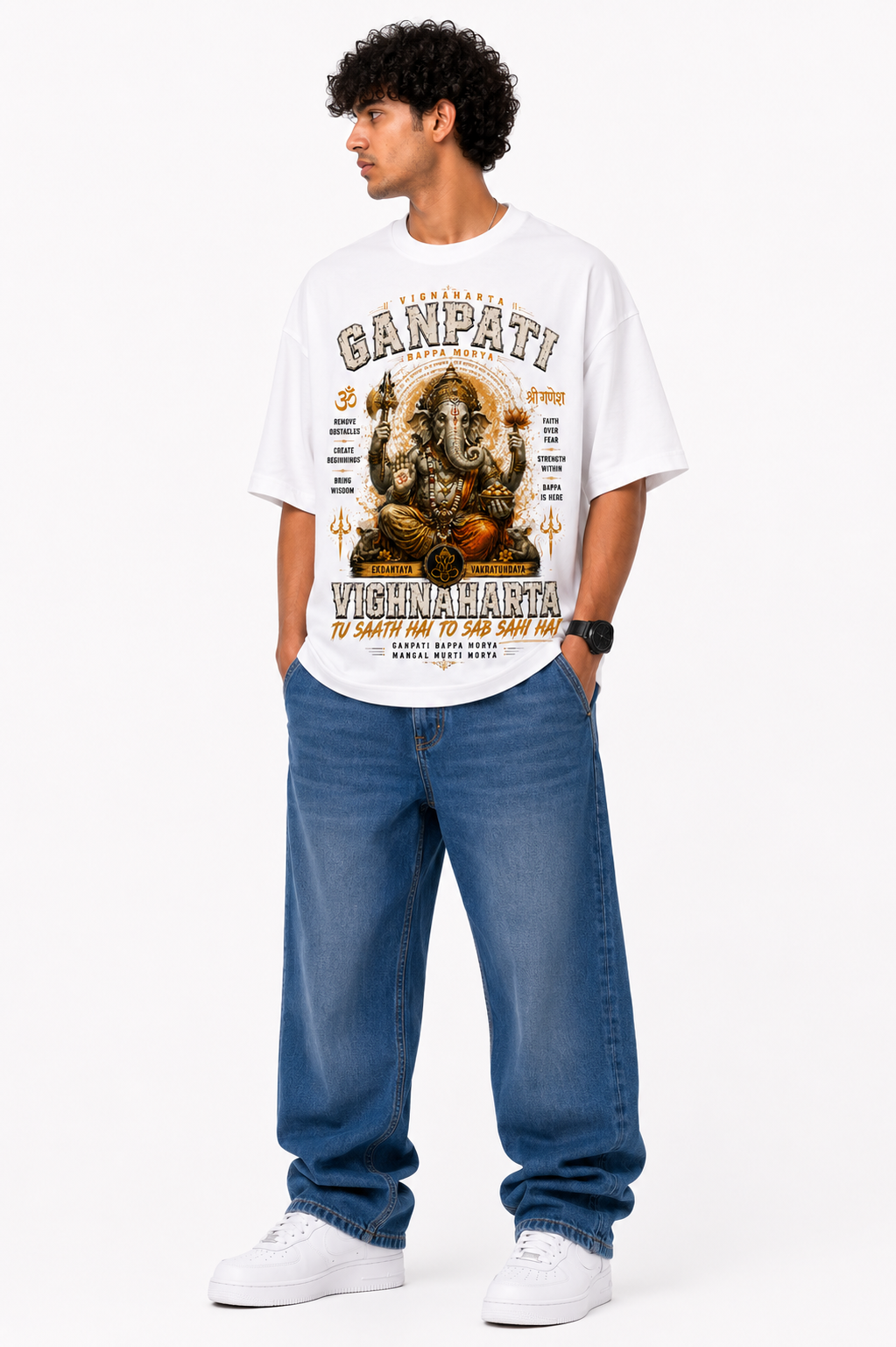 White oversized premium cotton T-shirt featuring an artistic Lord Hanuman illustration with bold Jai Hanuman typography, sacred verses, saffron brush accents, and spiritual streetwear styling from the StitchVaults™ HANUMAN LEGACY™ Collection.