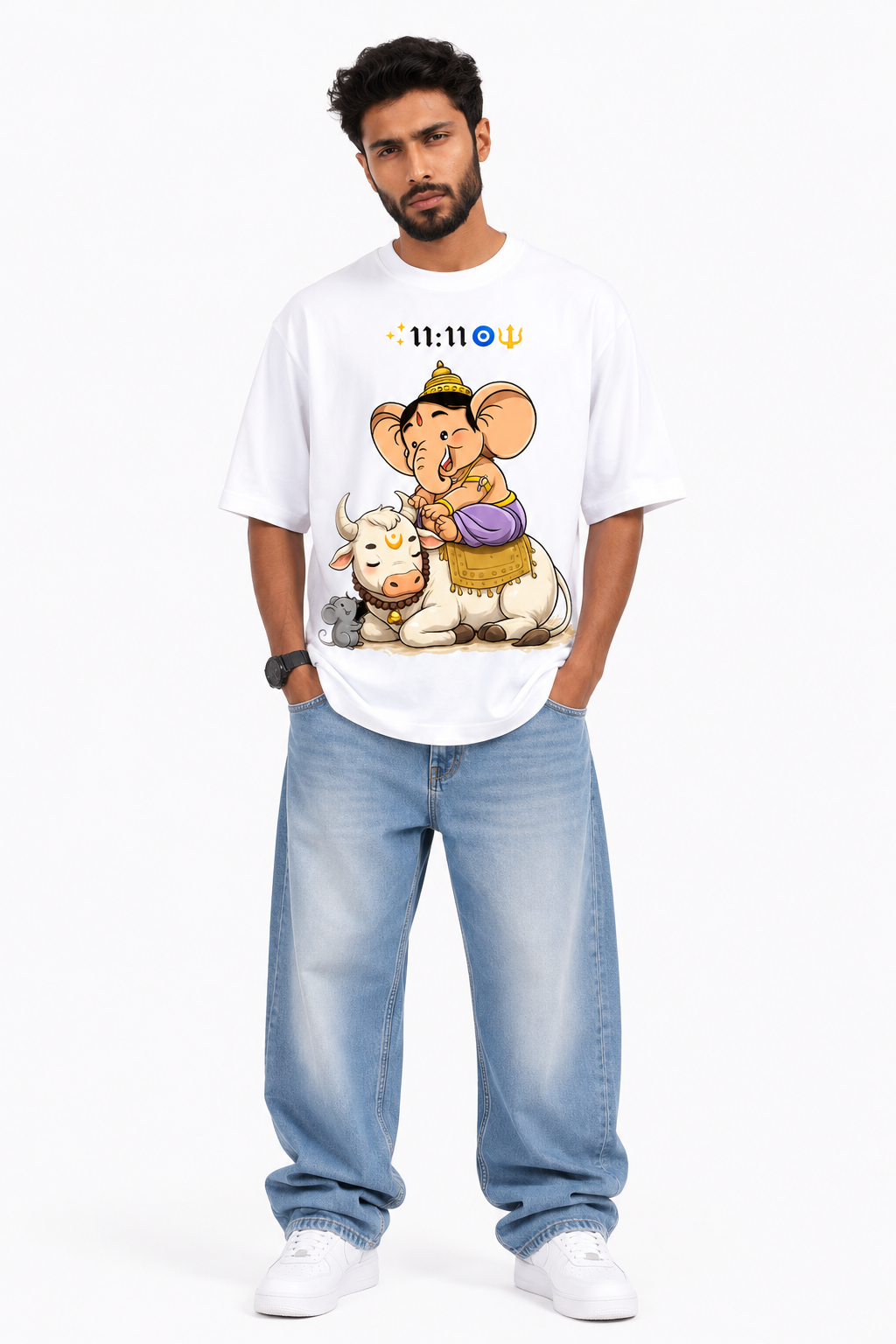 White oversized graphic T-shirt from the StitchVaults™ GANESHA LEGACY™ Collection featuring the exclusive 11:11 Blessings artwork of Bal Ganesha seated on Nandi with symbolic spiritual elements representing faith, protection, and new beginnings.