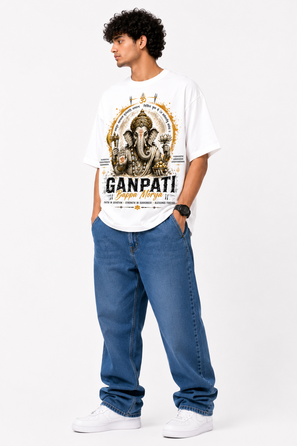 White oversized graphic T-shirt from the StitchVaults™ GANESHA LEGACY™ Collection featuring Lord Ganesha artwork with sacred Sanskrit verses, Om symbol, lotus motifs, and bold Ganpati Bappa Morya typography.