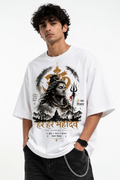 A man wearing a white graphic t-shirt featuring a detailed print of Lord Shiva with Devanagari text, paired with black jeans against a plain white background.
