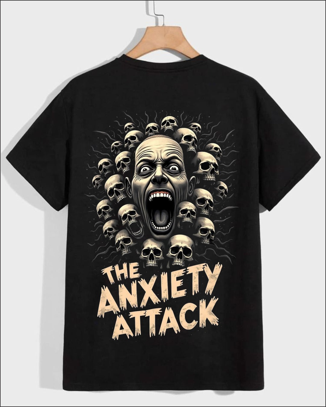 Black t-shirt with screaming face skull graphic and anxiety attack text print