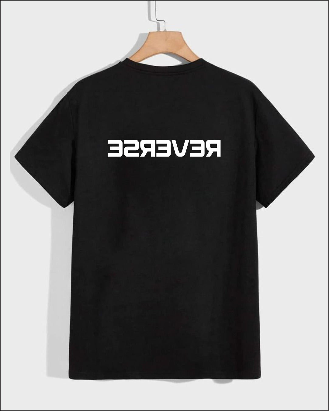Black t-shirt with minimalist mirrored “REVERSE” text design on the back