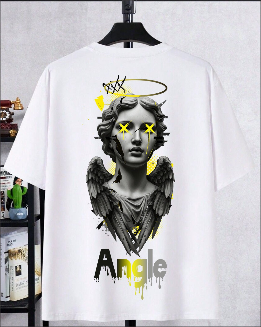 Angel graphic t-shirt with winged statue illustration and artistic streetwear design on white cotton fabric