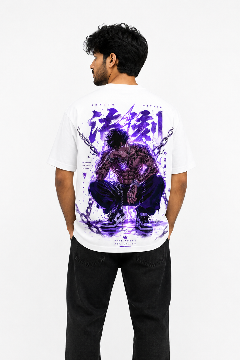 Person wearing a white t-shirt with a graphic design on the back