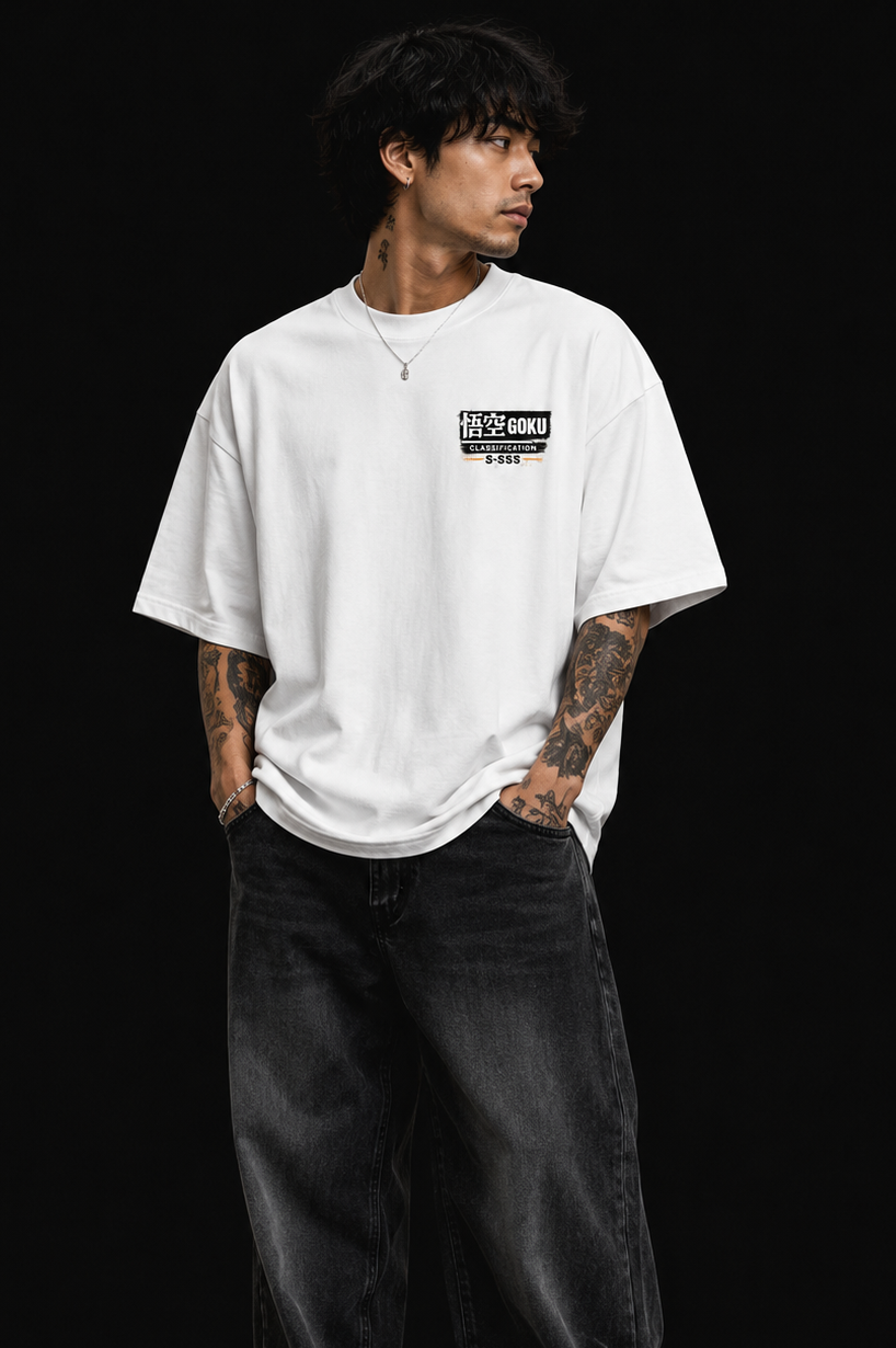 Person wearing a white t-shirt with a goku logo on a black background