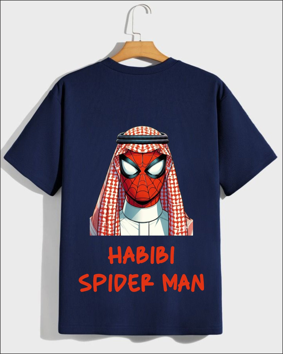Graphic t-shirt featuring masked superhero inspired artwork with Middle Eastern headwear and Habibi text on navy cotton fabric