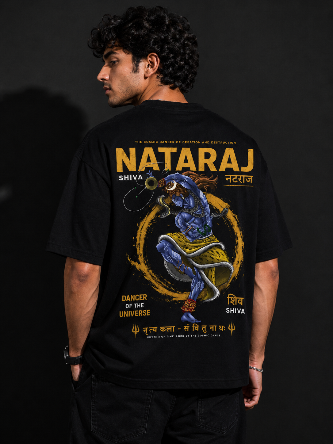 Person wearing a black t-shirt with 'Nataraj' design and text on the back.
