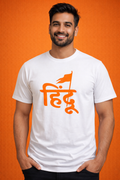 Man smiling in a white t-shirt featuring the word "Hindu" in saffron orange Devanagari script with a Bhagwa flag icon.