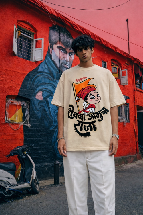 Detailed view of the ChikuPiku warrior character illustration and "Shivba Aamucha Raja" text on premium sand-colored cotton.