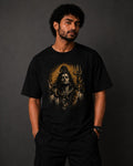 Person wearing a black t-shirt with a shiv ji graphic design on a dark background