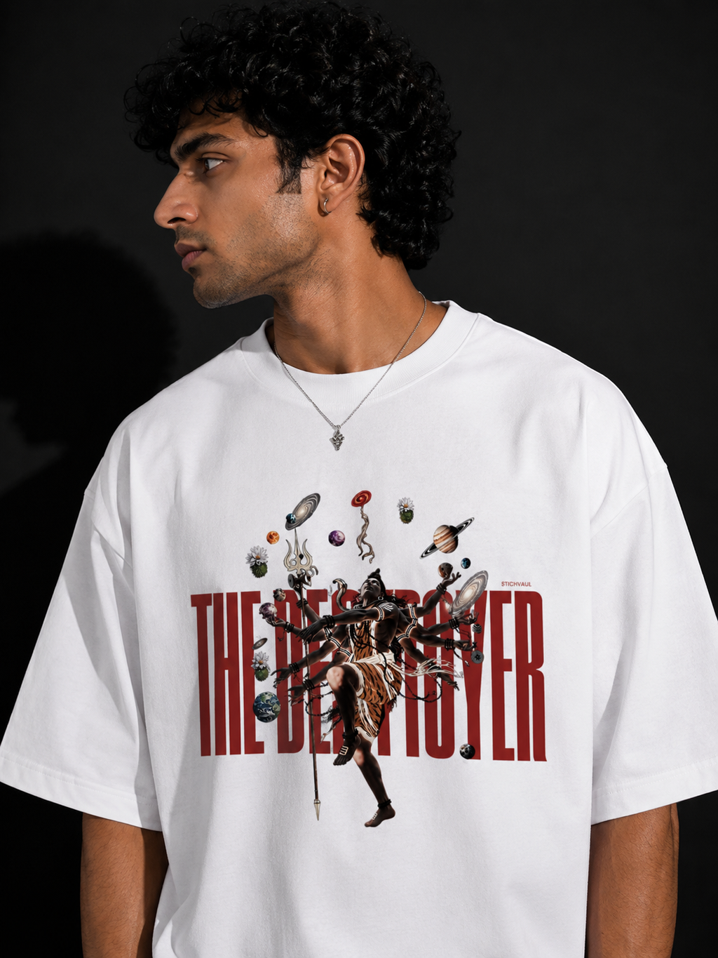Person wearing a white t-shirt with 'The Destroyer' graphic design on a black background